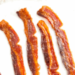 a plate of bacon jerky