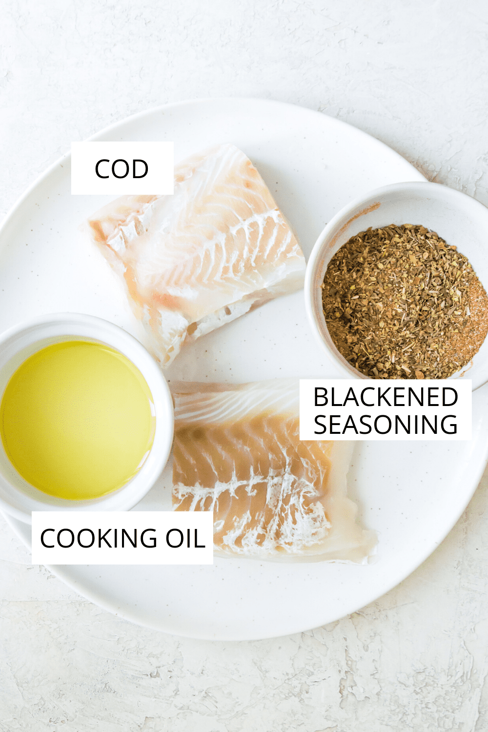 A plate full of the ingredients needed to make blackened cod. 
