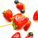 A TikTok candied strawberry on a bamboo skewer