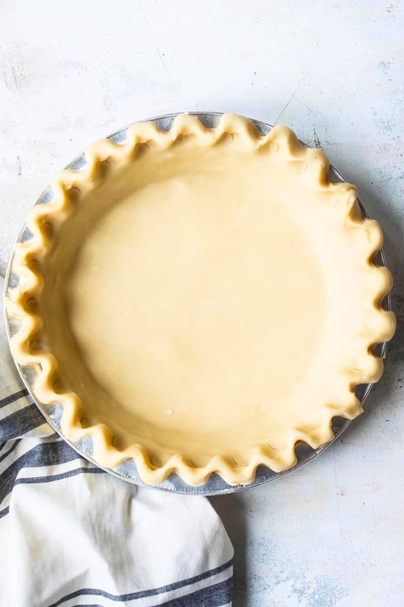 A pie crust on a counter top.