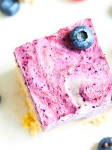 A paleo ice cream bar with a fresh blueberry on it.