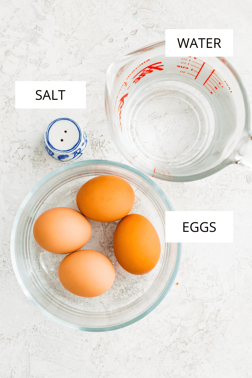 Ingredients needed to make hard boiled eggs in a microwave.