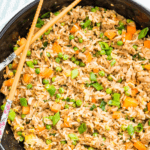 A pan of tuna fried rice with chopsticks