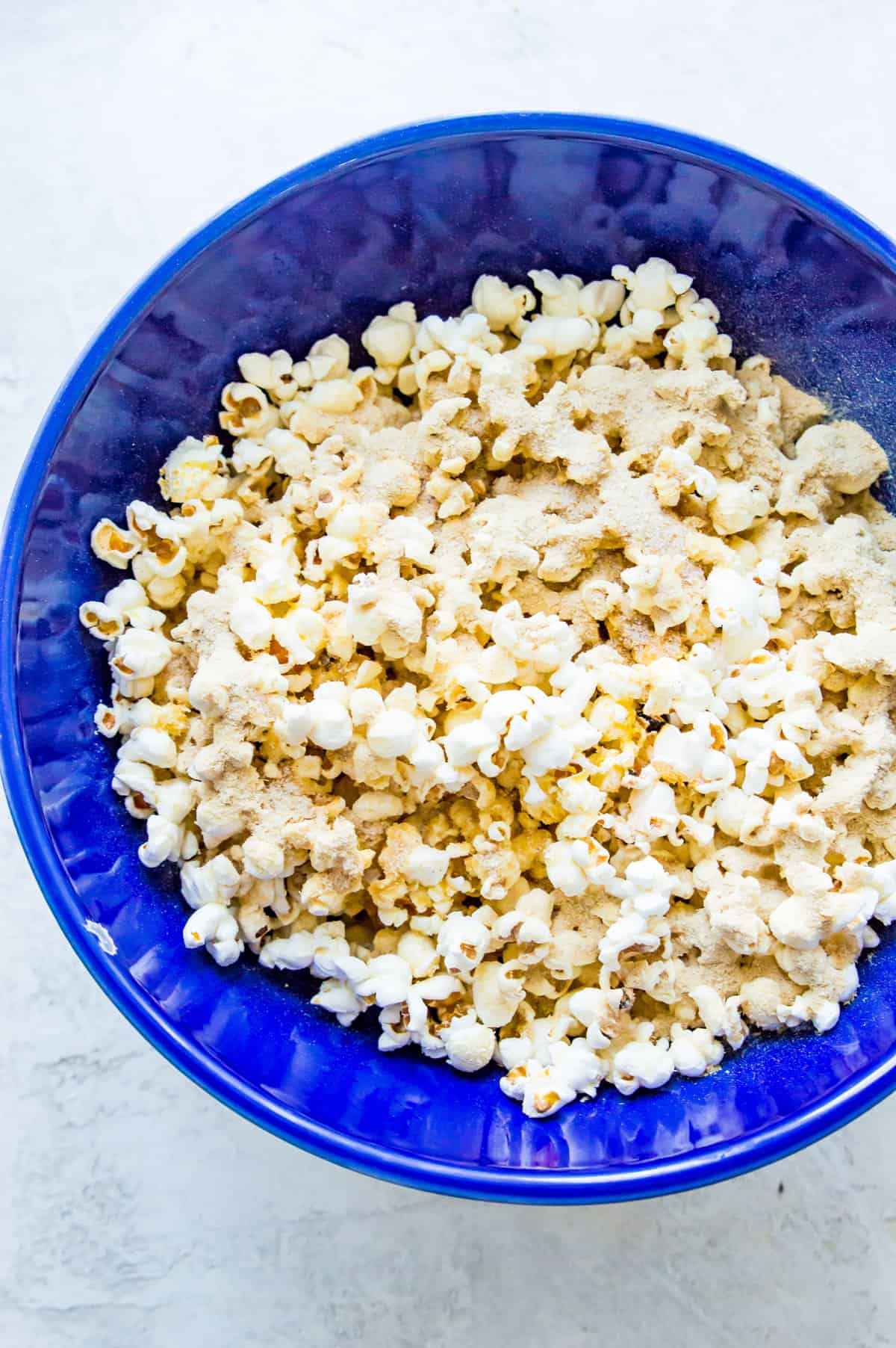 Popcorn in a large blue bowl.