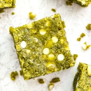 A matcha brownie with white chocolate chips in it.
