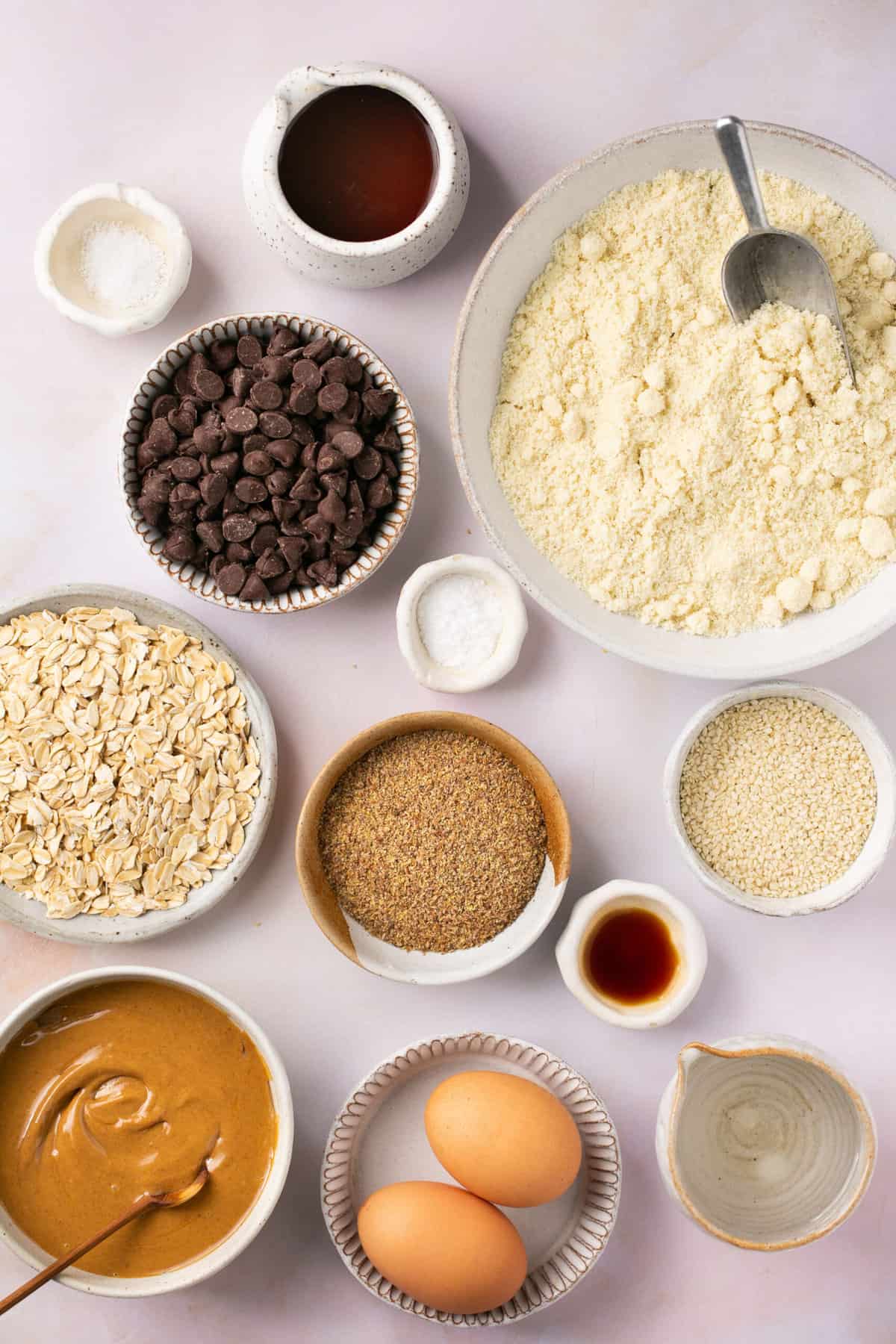 The ingredients needed to make lactation bars in little bowls and dishes. 