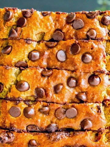 Pieces of chocolate chip banana bread stacked on top of each other.