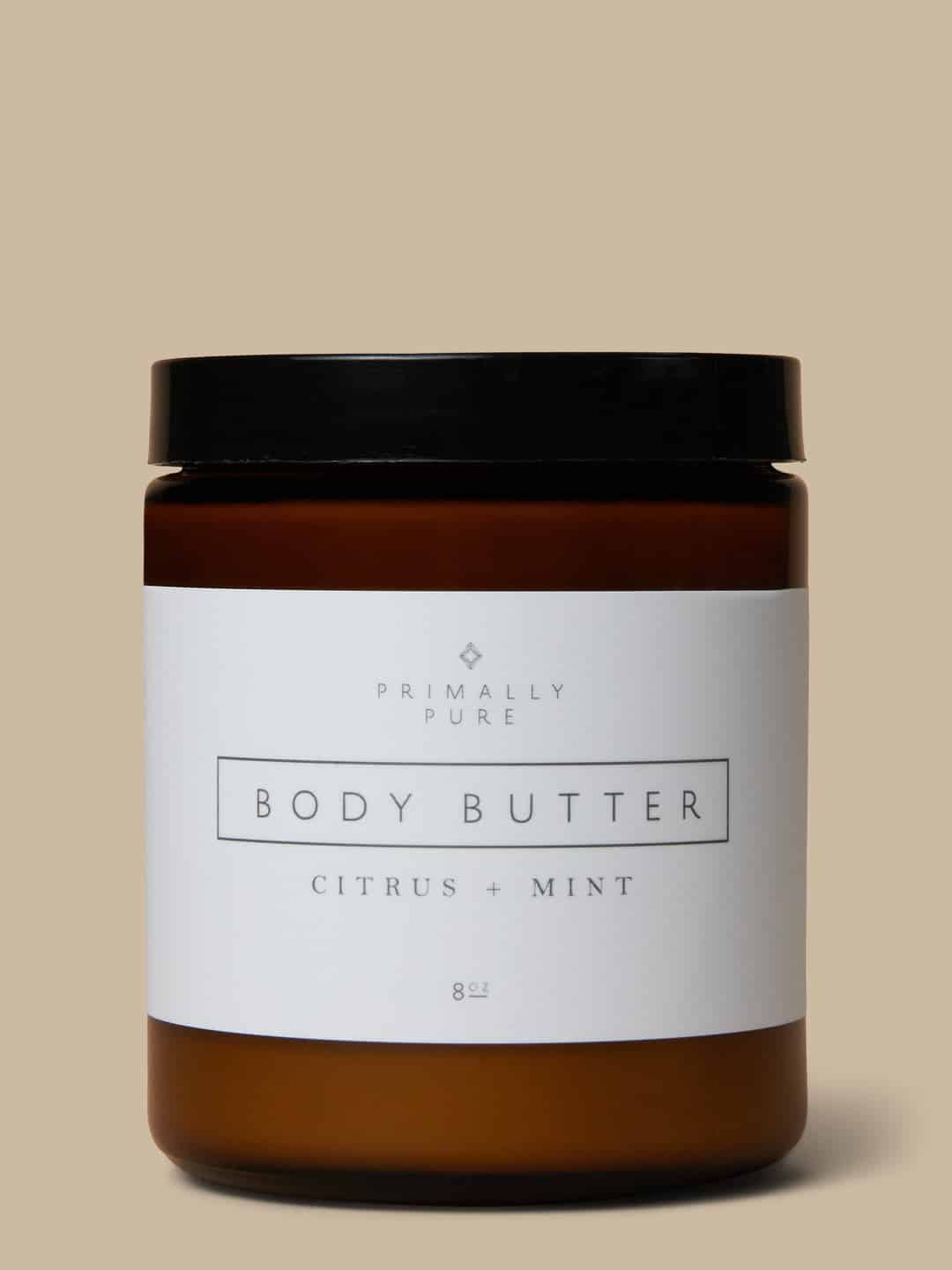 A glass jar of Primally Pure body butter.