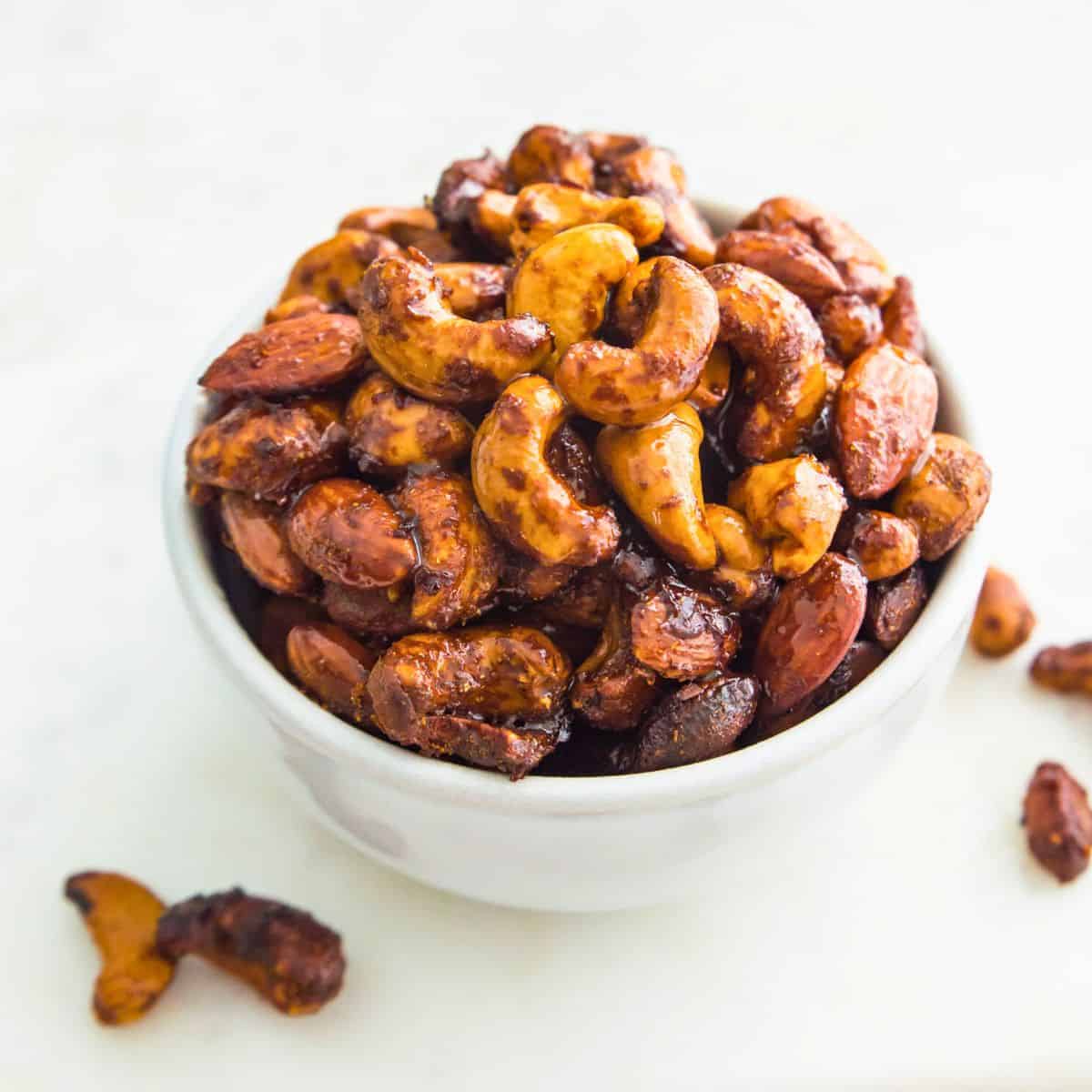 Glazed cashews and almonds in a bowl.