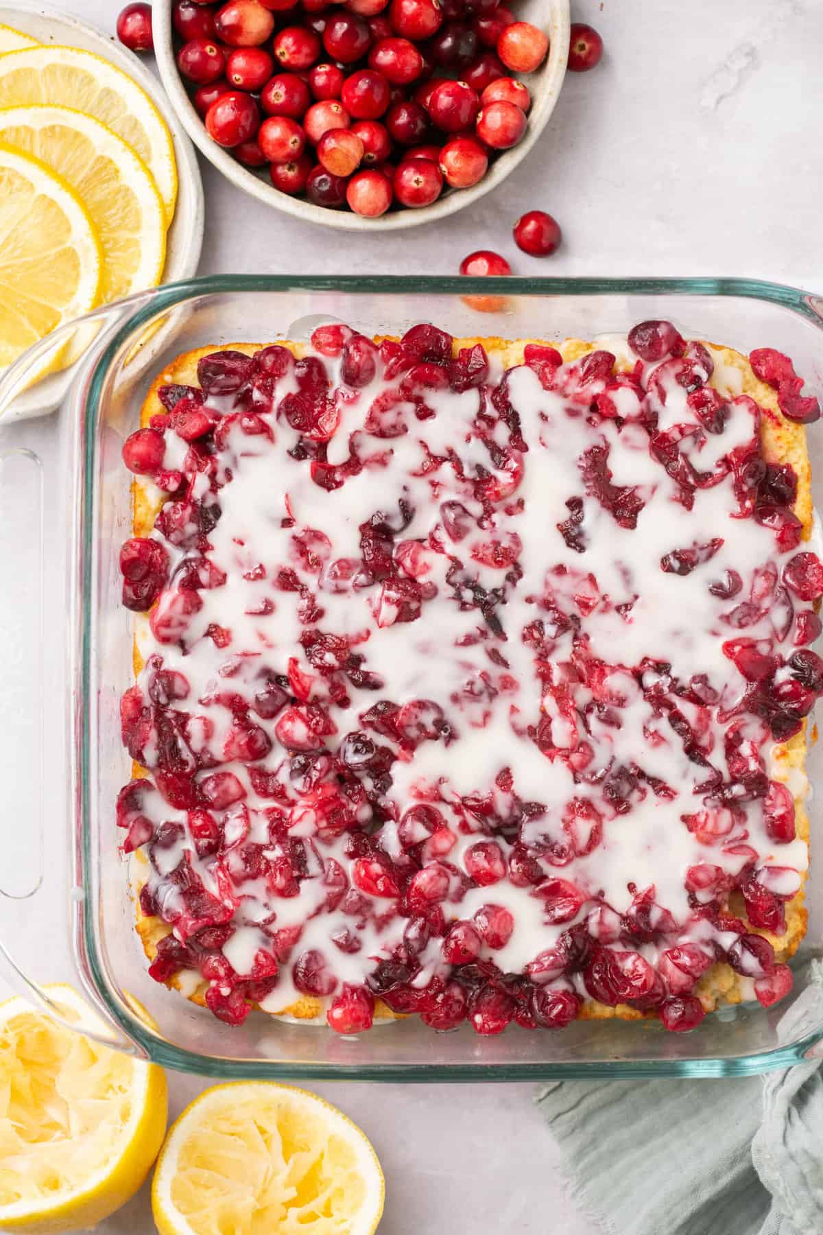 Cranberry lemon squares with melted coconut butter on top.