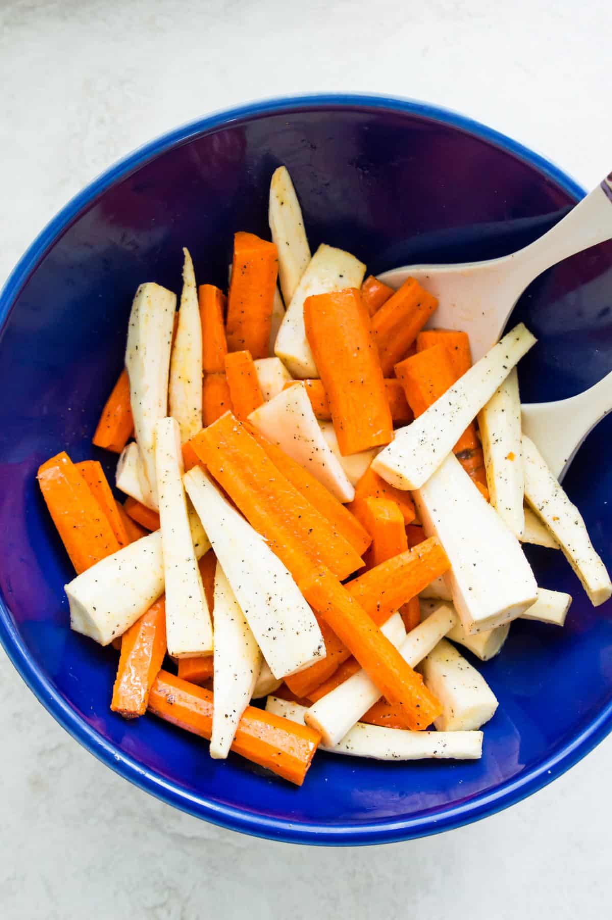 Cut up carrots and parsnips, in a large bowl. 