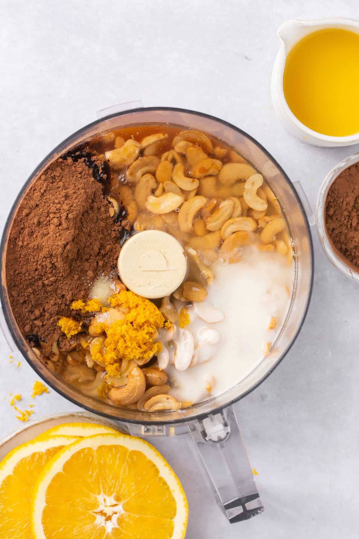 Orange juice, cashews, cocoa powder and maple syrup in a food processor. 