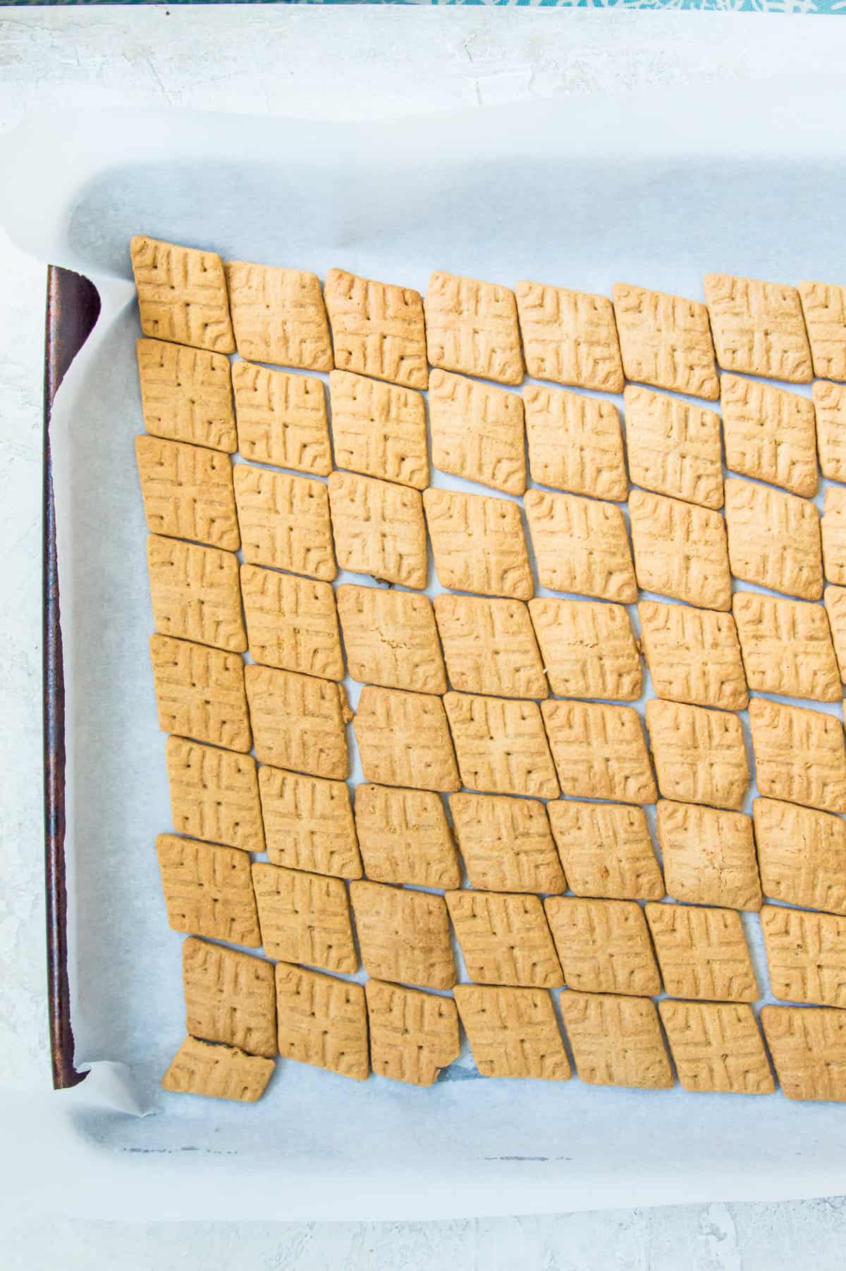 Graham crackers on a piece of parchment paper. 