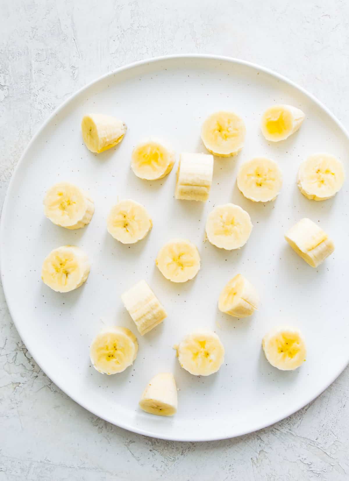 Banana slices on a plate. 