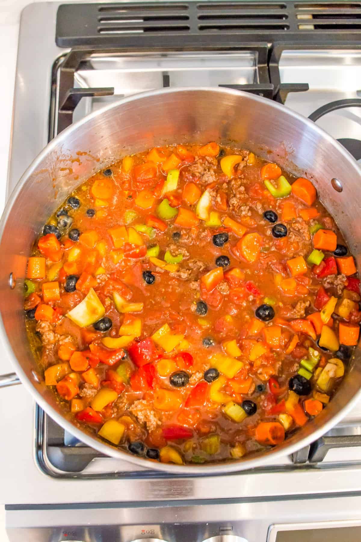 A pot filled with no bean chili on the stovetop.