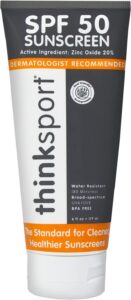 A bottle of Thinksport SPF 50 sunscreen lotion.