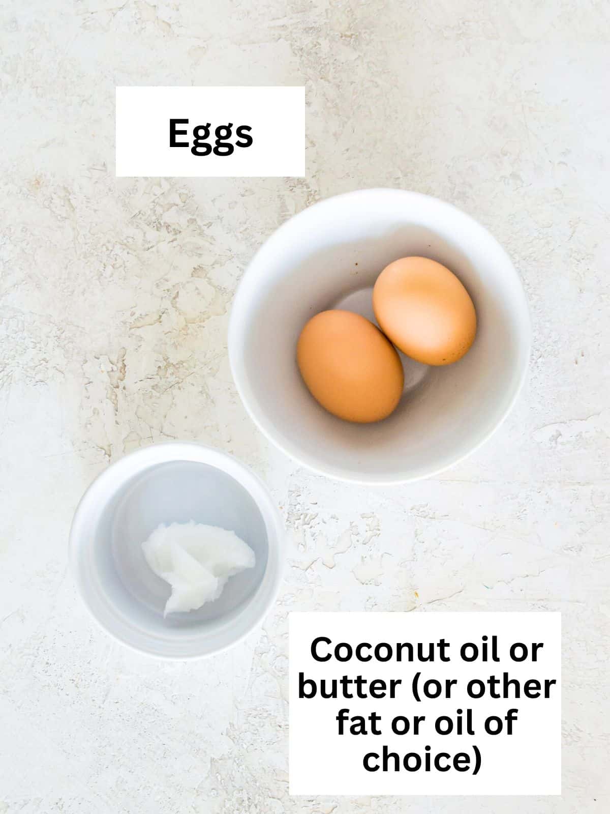 The ingredients needed to make over medium eggs separated into small bowls. 