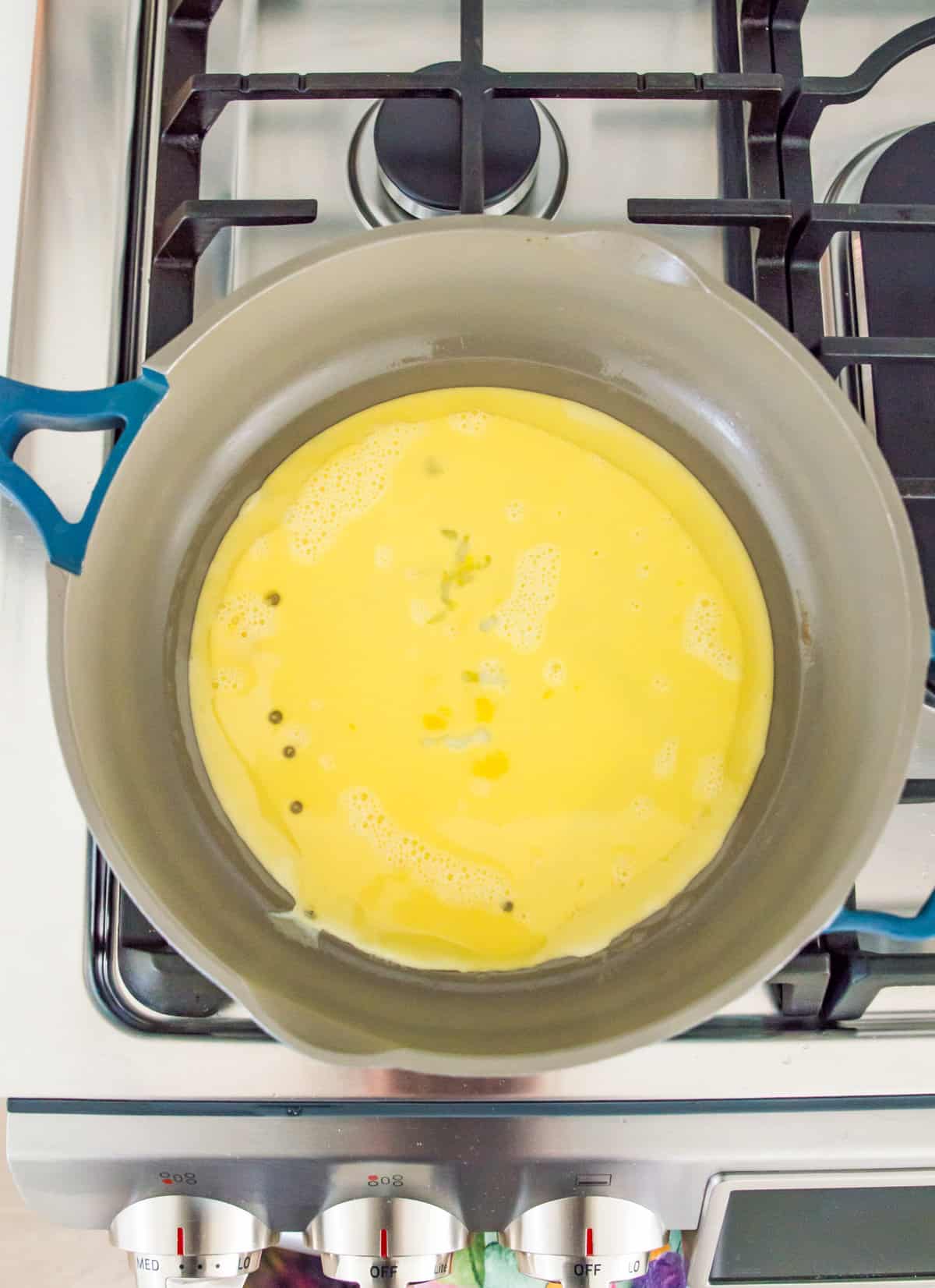 Eggs in a pan on a stovetop.