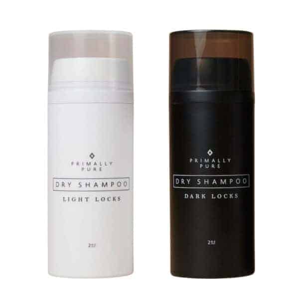 Two bottles of Primally Pure dry shampoo. 