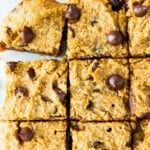 A batch of pumpkin chocolate chip bars cut into squares.