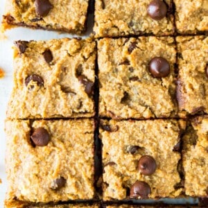 Pumpkin chocolate chip cookie bars cut into pieces.