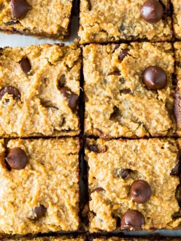 Pumpkin chocolate chip cookie bars cut into pieces.