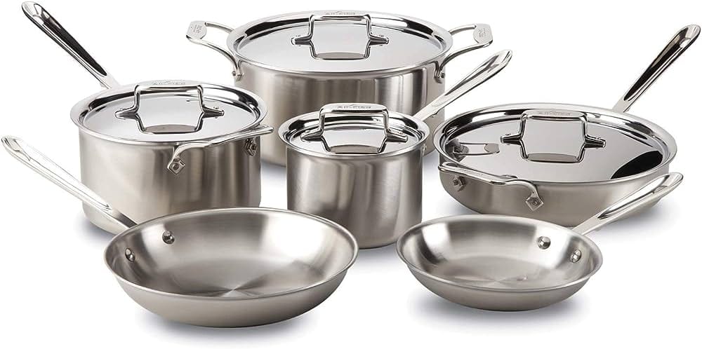 A set of All-Clad stainless steel cookware including pots and pans. 