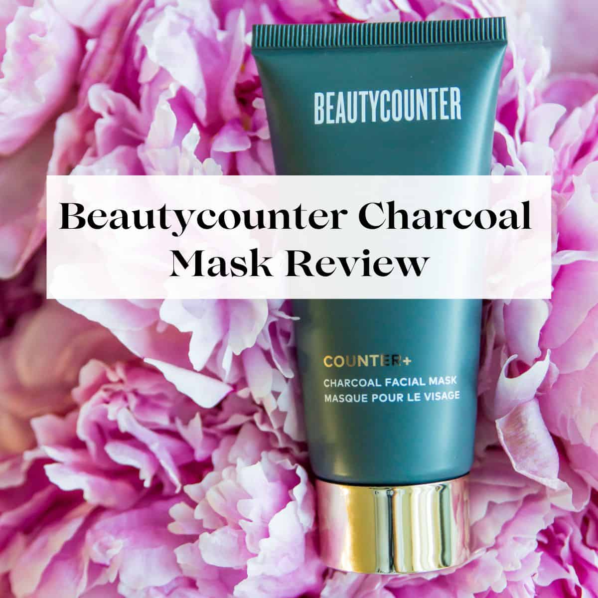 A tube of Beautycounter's charcoal mask on a batch of pink peonies with the title Beautycounter Charcoal Mask Review over it.