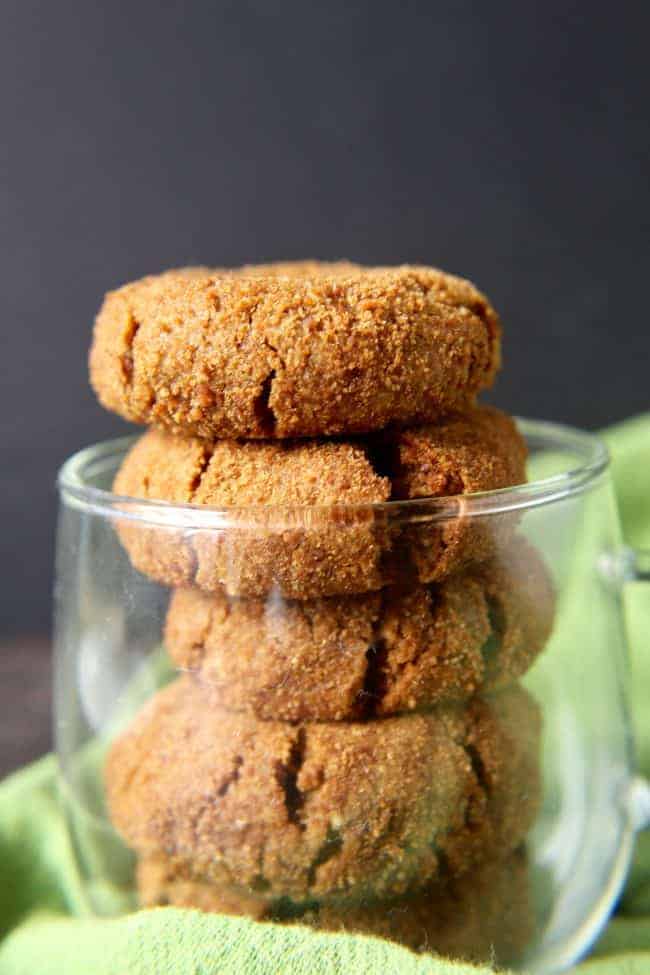 A serving glass filled with a stack of paleo snickerdoodle cookies. 