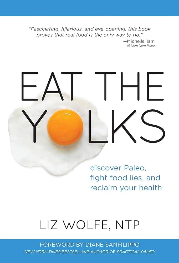 The cover of the book "Eat the Yolks" which has a cooked sunny side up egg on it.