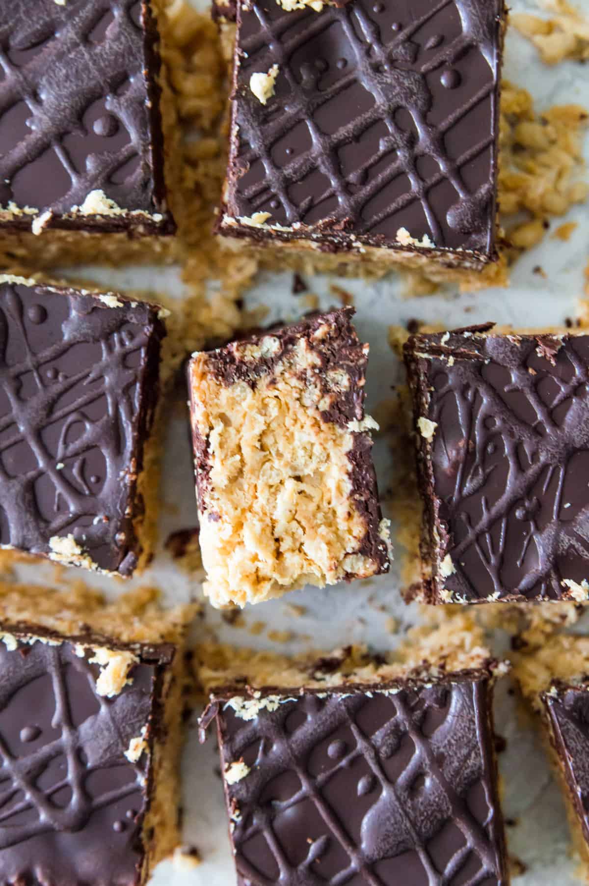 A batch of peanut butter and chocolate Rice Krispie Treats cut into square pieces. 