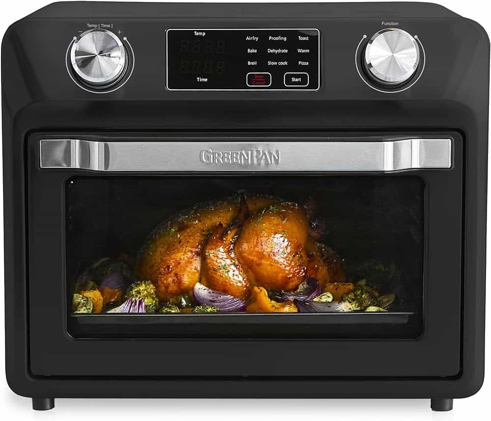 A GreenPan brand air fryer in black with a roasted chicken in it.