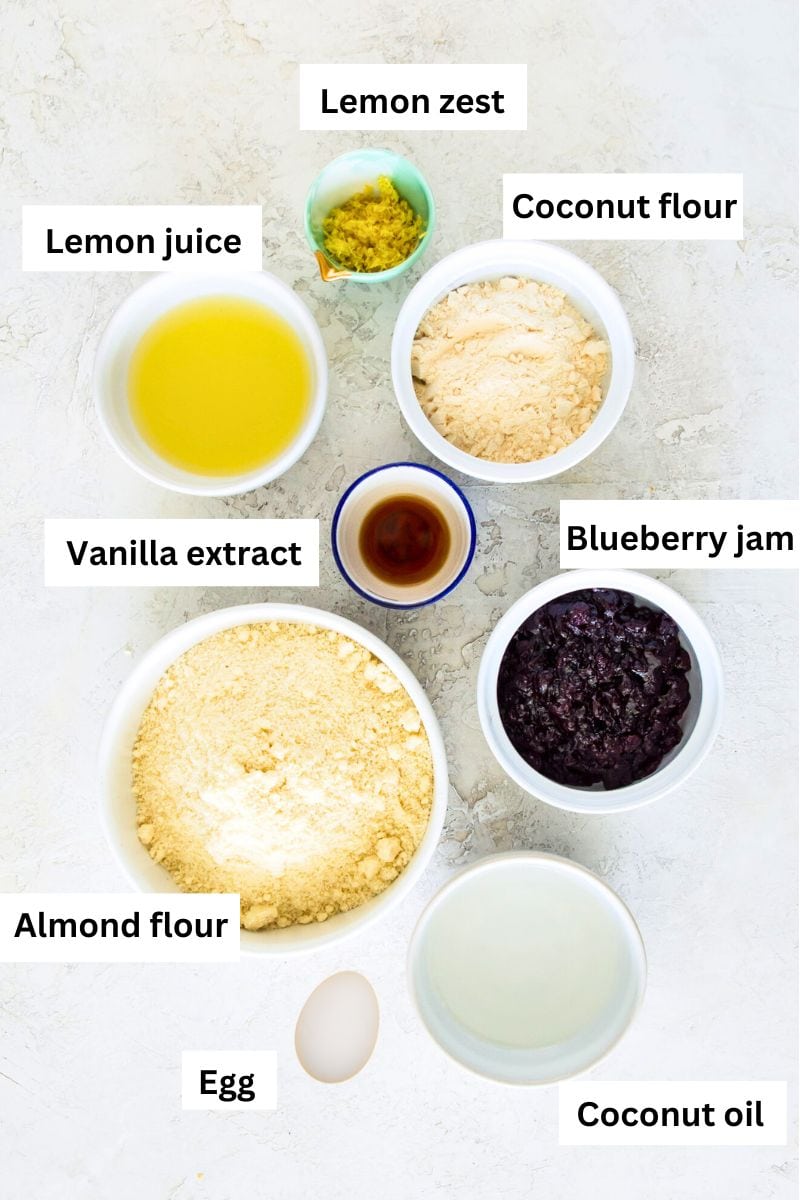The ingredients needed to make gluten free lemon pop tarts separated into bowls including almond flour, lemon zest, lemon juice, coconut flour, tapioca flour and coconut oil.