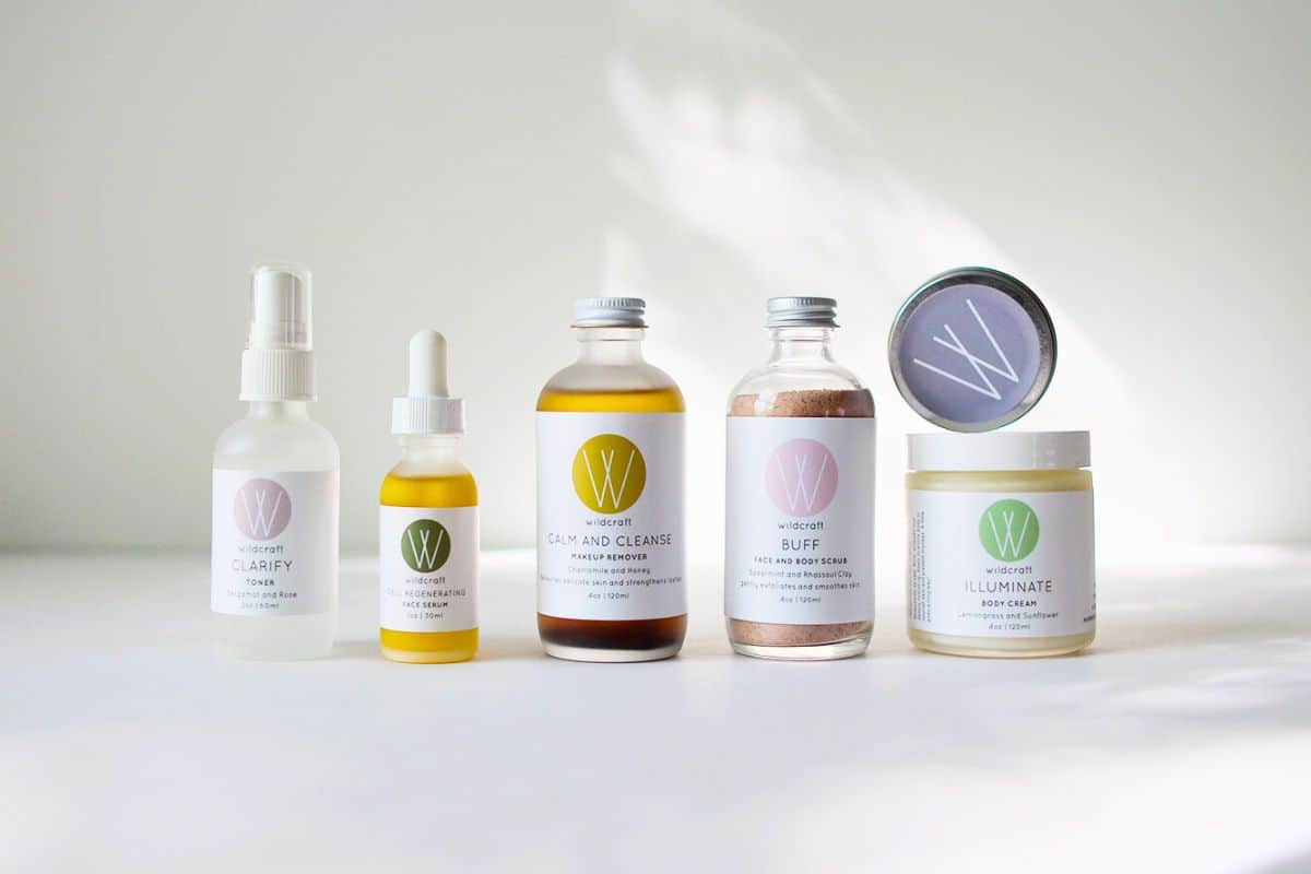 A collection of Wildcraft brand skincare products in glass jars and bottles.